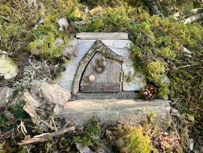 fairy door surrounded by moss