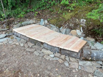 low bench made from rock and wood